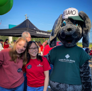 image of little elmo and two female staff 